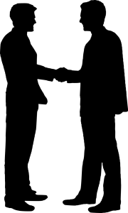 A silhouette of two people shaking hands