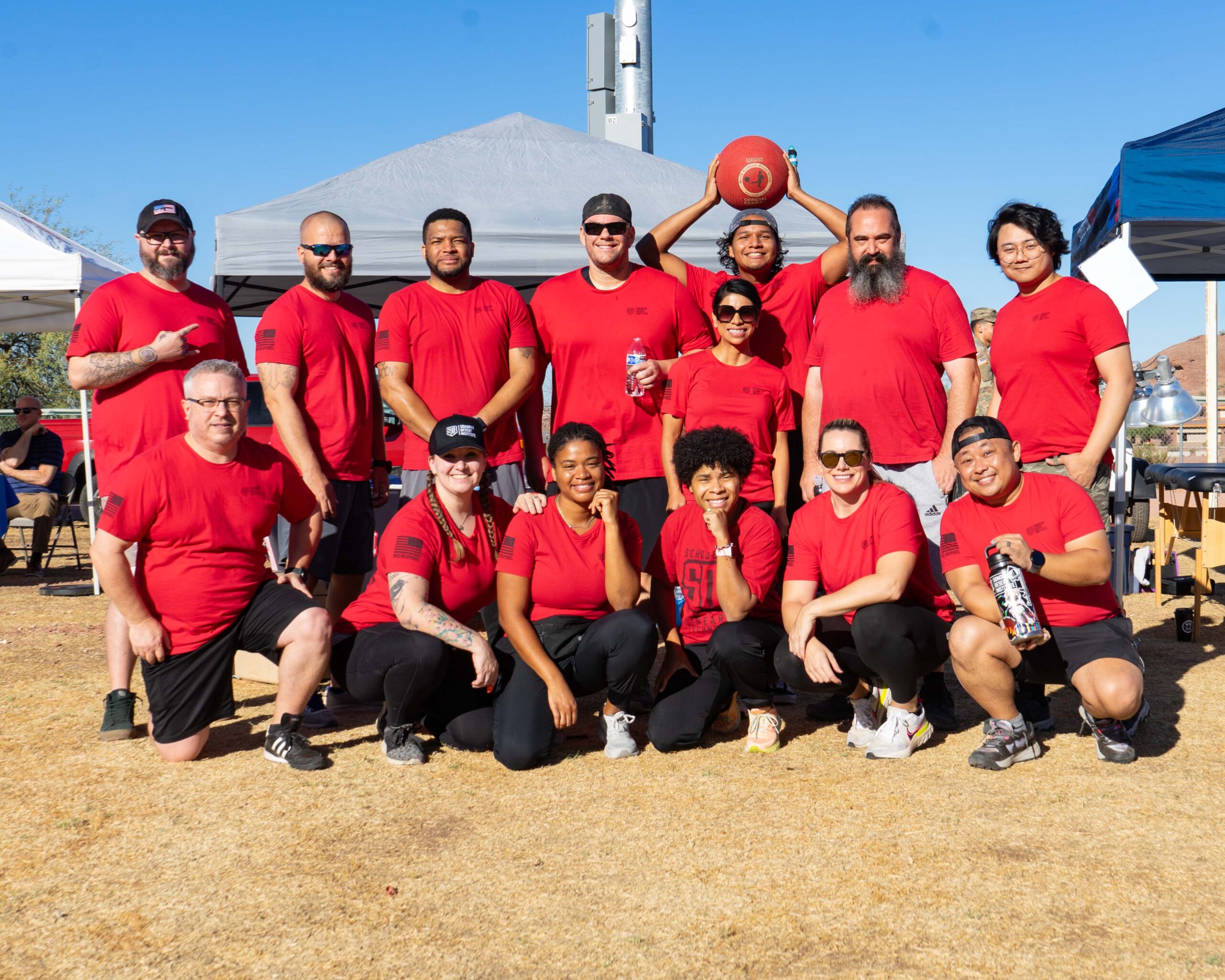 Members of Sonoran Desert Institute pose for a team photo at the Arizona National Guard 8th Annual Kickball Tournament and Resource Fair at the Papago Park Military Reservation.