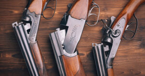 Classic shotguns on table